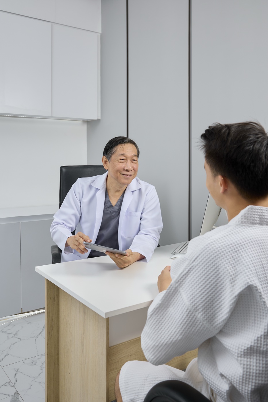 A MENHANCE doctor in an online consultation with a patient